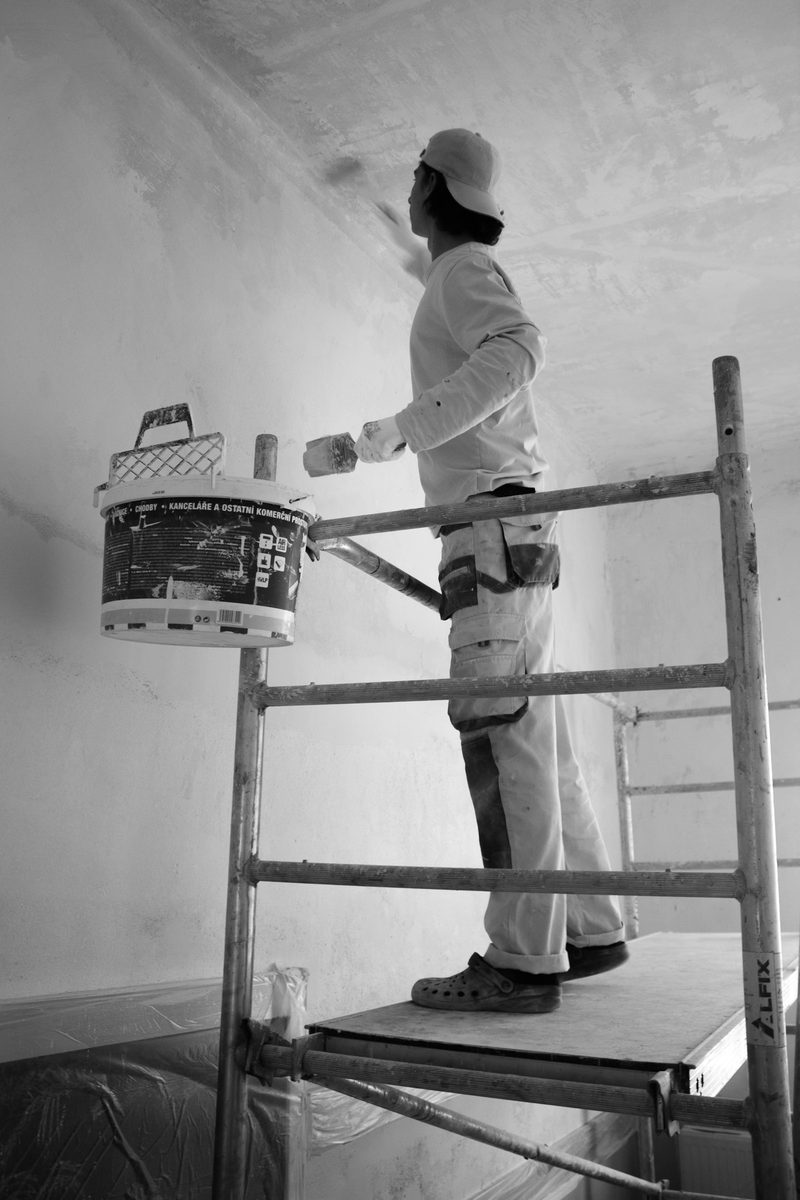 Painter working on a building exterior