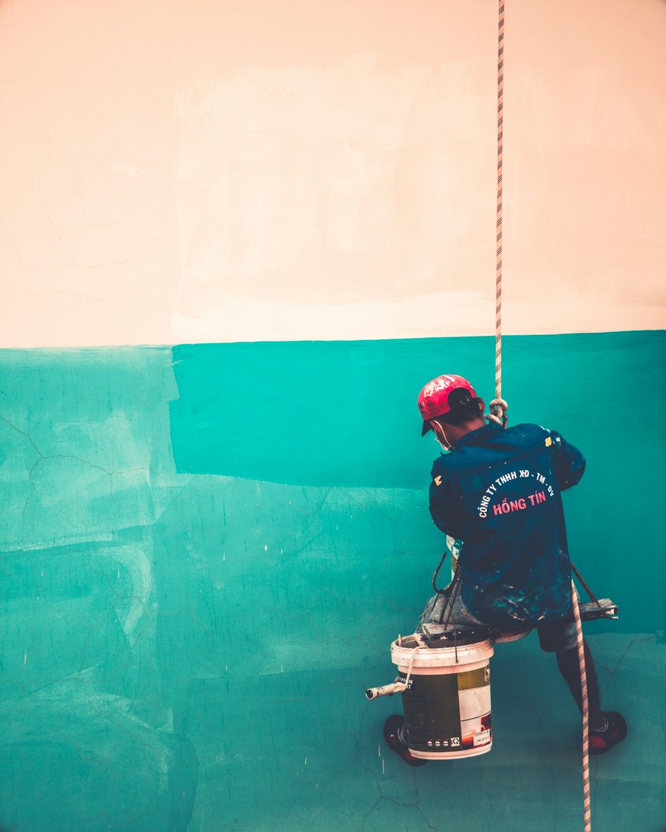 Painter at work on an interior wall